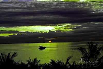 Cruise ship sailing towards the Manila bay amazing orange sunset at Manila Bay Philippines 