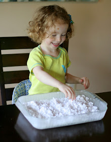 Frozen Sensory Snow - Easy, cheap (cost around one dollar!), and the icy cold lasted for TWO hours while we played!  Perfect for keeping cool this summer from Fun at Home with Kids