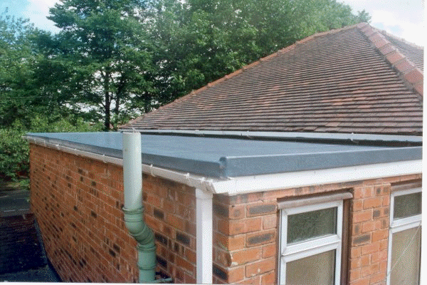 flat roof smooth surface leads into a hip style roof