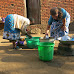 Photos of Bill Gates' Wife Melinda Washing Plates in Malawi