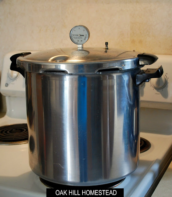 Presto pressure canner on a stove.