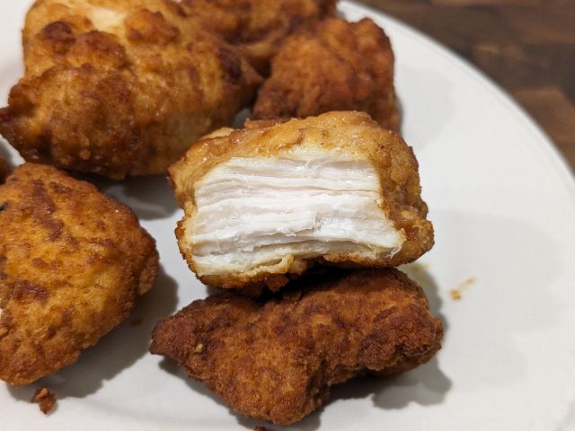 Realgood Lightly Breaded Chicken Nuggets cross-section.