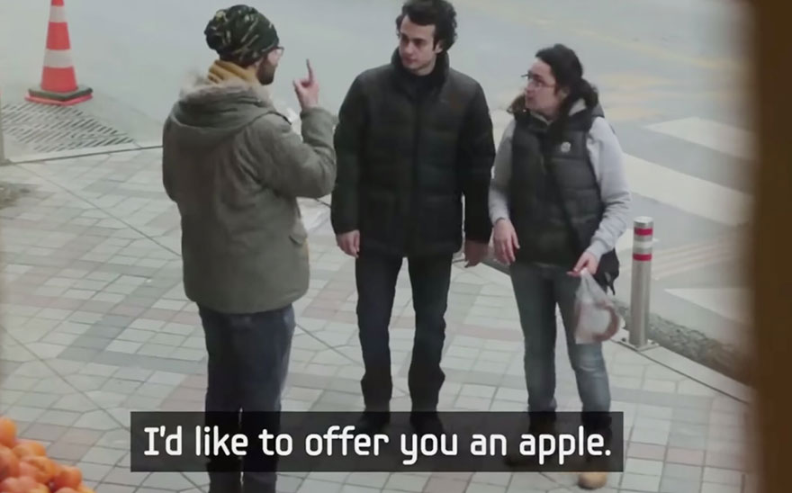 Entire Neighbourhood Secretly Learns Sign Language To Surprise Deaf Neighbor - …He offers them each an apple - in sign language
