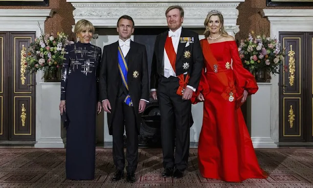 Queen Maxima wore a new red satin dress by Claes Iversen. President Emmanuel Macron and Brigitte Macron