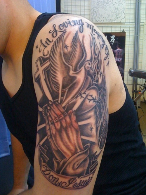 tattoos on shoulder for men. cross tattoo designs for men