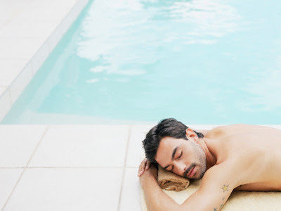 Sleeping mature man with yellow star tattoo on his sleeve.