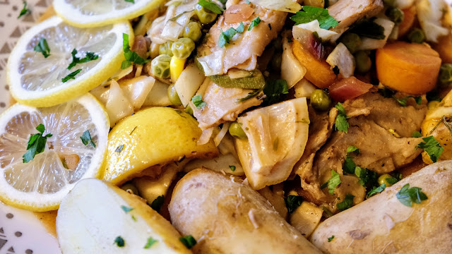 Lemon on a plate with mock meat and potatoes