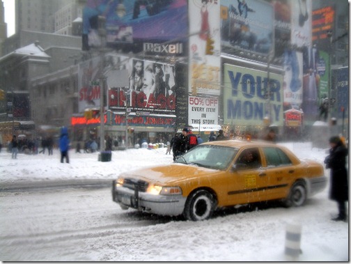 yellow-cab-nyc-times-square-snow