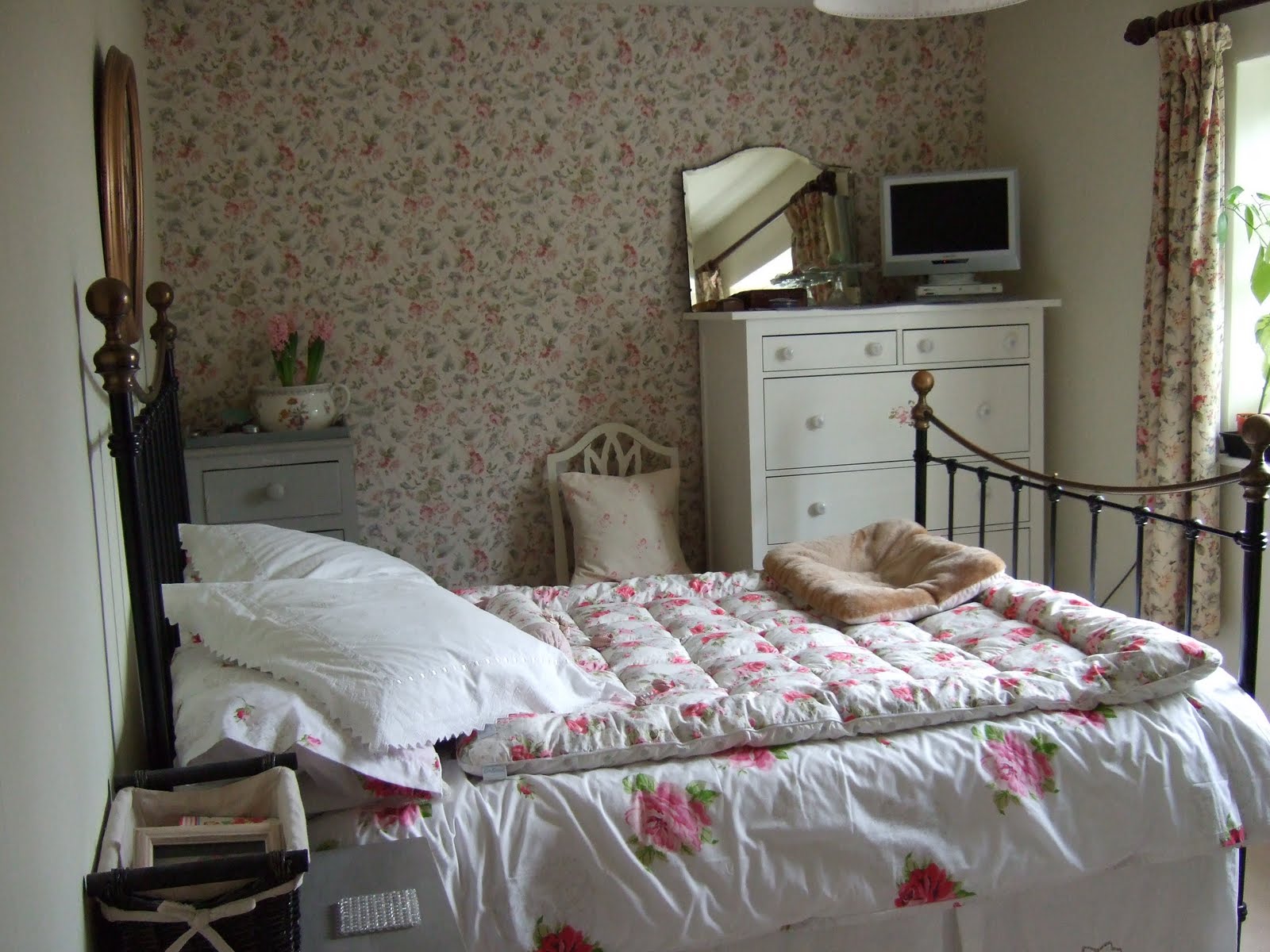 Guest room: curtains and wallpaper both in the Laura Ashley 'Melrose' 