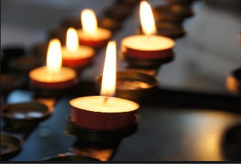 Image showing candle light at a certain funeral