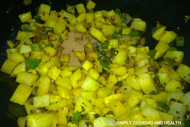 Adding coriander powder