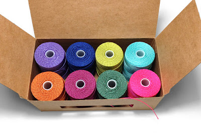 C-Lon Bead Cord in cardboard boxes