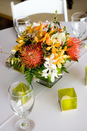 I just wanted to share these amazing red orange tropical centerpieces 