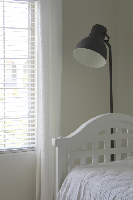 Vintage white daybed with Ikea Hektar floor lamp by Hello Lovely Studio