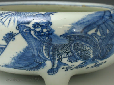 <img src="Chinese kangxi incense burner.jpg" alt="blue and white burner detail of foo lions">