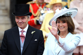 Michael and Carole Middleton smile and wave at the crowds following the marriage of Prince William, Duke of Cambridge and Catherine, Duchess of Cambridge.