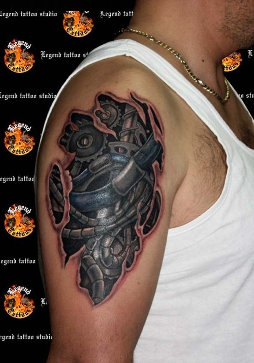 biomechanical tattoo on the shoulder and upper arm