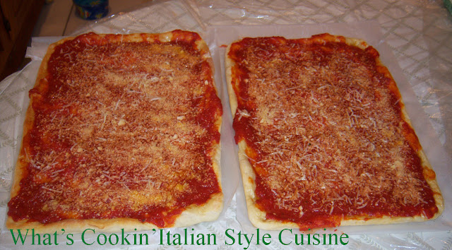 Tomato Pie Recipe from Upstate Utica New York is a pizza dough that is risen high, cooked with tomato sauce and grated cheese without mozzarella. It is well known in Utica, Rome and in the upstate new york area. It is like a bread with sauce and romano cheese on it
