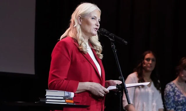 Brynjulf Jung Tjønn. Crown Princess Mette-Marit wore a red double-breasted-buttoned blazer, and high-waist trousers by Zara