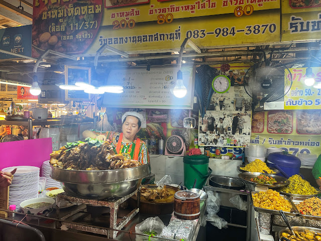 a small restaurant selling khao khao moo at Or Tor Kor Market, Bangkok, Thailand