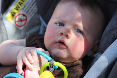 fussy four month old in a happy moment