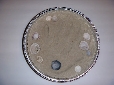 aluminum cake pan, plaster of paris, sand, sea shells, hand print art, shadow box