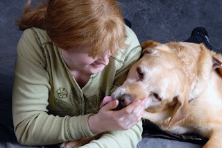 Kellie Gerdts lying with her Guide Dog July