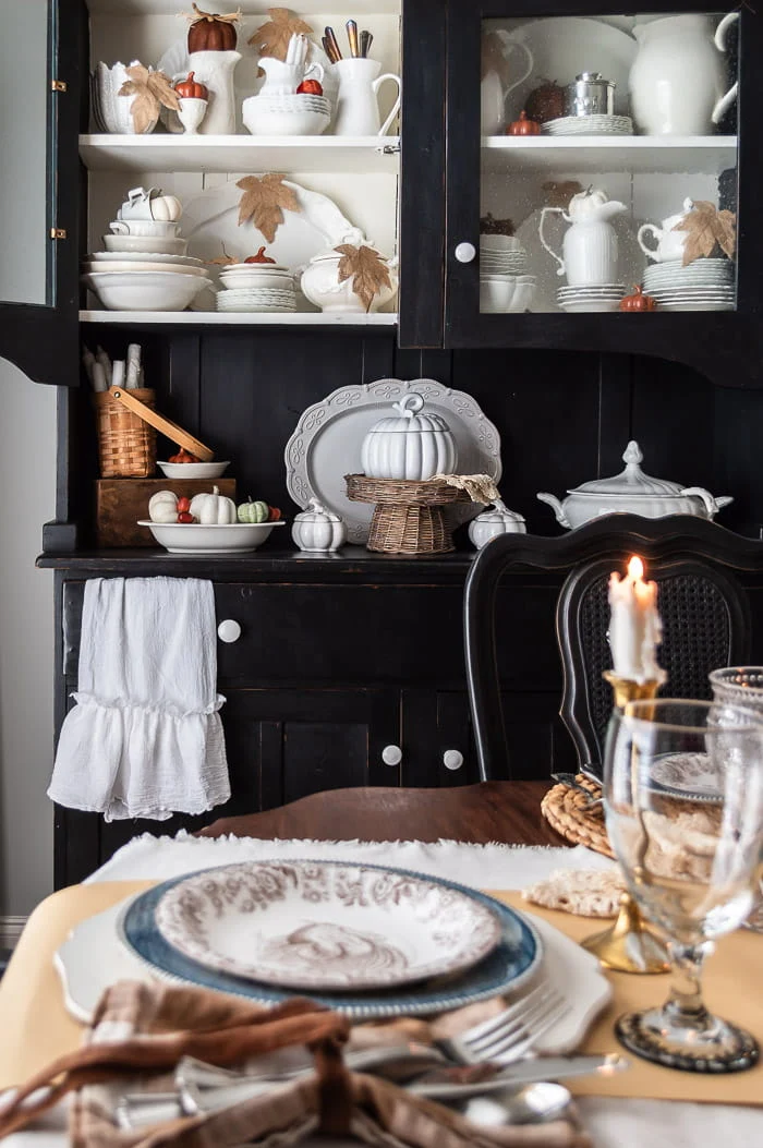 black hutch, pumpkins, white ironstone