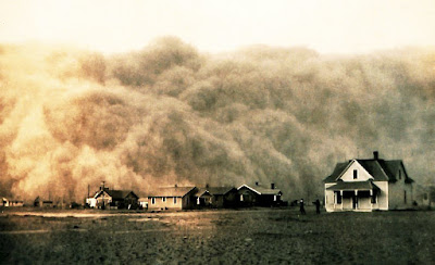 Massive high dust storm about to cover houses and a farm