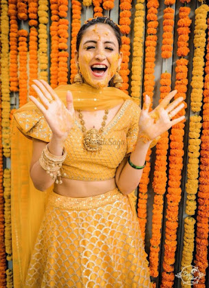 top yellow lehenga with jewllery