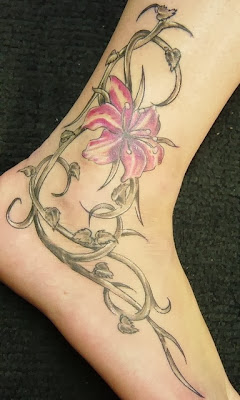 tribal flower tattoo on foot