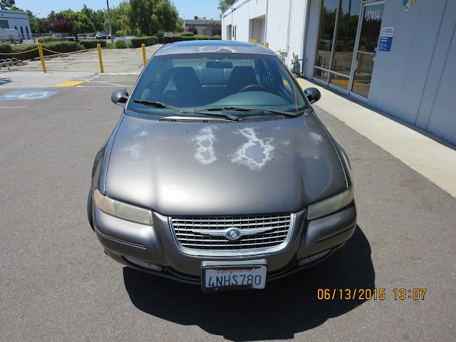 Faded, peeling paint on hood before repainting at Almost Everything Auto Body.