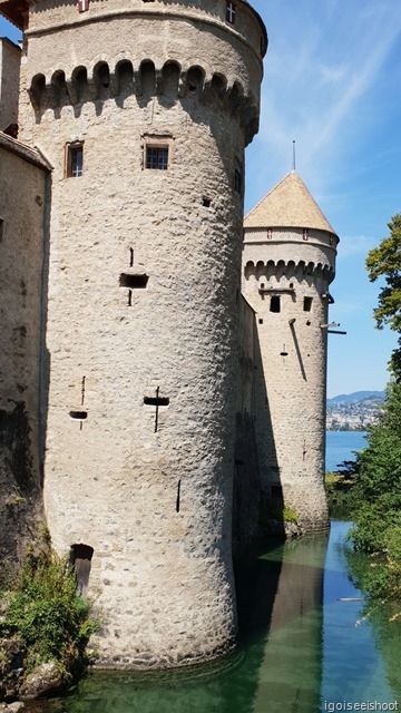 The lake forming a natural moat around Chillon Castle.