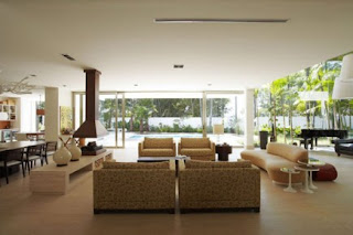 spacious living room, with a view towards the swimming pool and a cream composition of the dominant