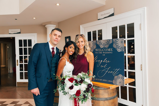 Niagara Wedding Planner - A Divine Affair - Meaghan and Scott - Photo by Marco Roxas Photography. Wedding ceremony and reception at Chateau des Charmes Winery in Niagara on the Lake. Navy Blue and Burgundy colours with Gold accents in the wedding attire and decor. Sweets table on wine barrels by Sweet Bash Co.