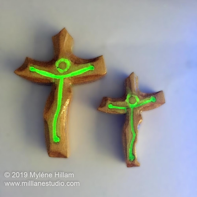 Resin and wood crucifix glowing in the dark