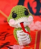 http://www.ravelry.com/patterns/library/lucky-snake-crochet-amigurumi-free-pattern