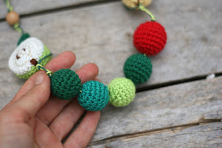 The very hungry caterpillar crochet teething baby wearing necklace