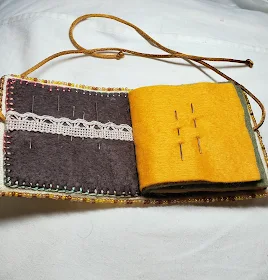 Free Autumn Cross Stitch pattern By Lynn B , beaded needlebook stitched with cotton threads and trimmed with beads. Pattern is a little bird  sat on a birdhouse with an autumn tree in the background
