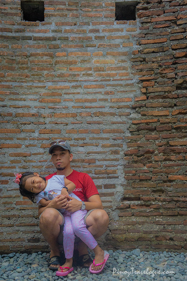 My daughter and I between the original and restored walls of Baluarte