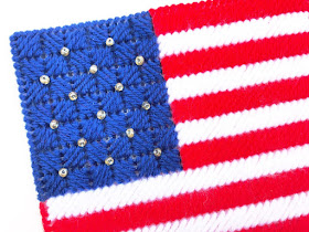 Decorate for a patriotic summer with these easy plastic canvas pattern. This USA flag napkin holder will take your dessert table or picnic table from "cool" to "amazing"! This pattern stitches up in no time at all to leave you enjoying the party with your guests.