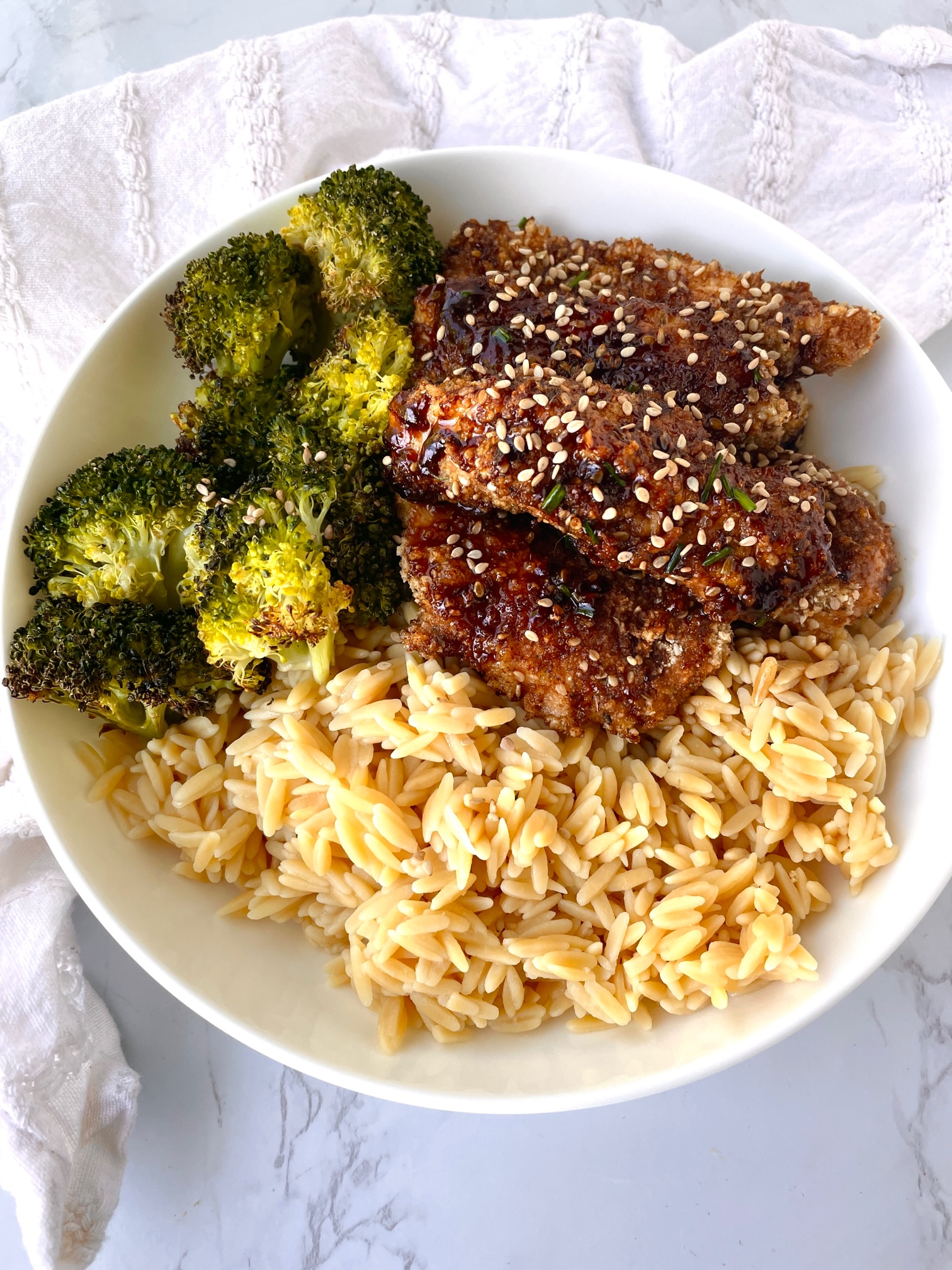 Sesame Chicken with rice and roasted broccoli