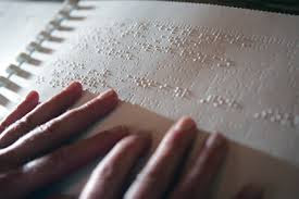 hands on an open book of braille; Sometimes Inclusion Makes Me Nervous; Removing the Stumbling Block