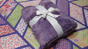 Split Arrows quilt - a chevron baby quilt made with pink and purple fabrics