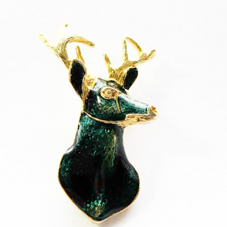 Green enamel reindeer brooch 