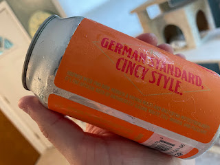 Showing off the illegible gold text on the Märzen can.