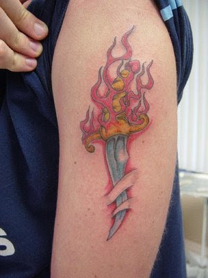 manly tattoos. Flaming Dagger Tattoo From