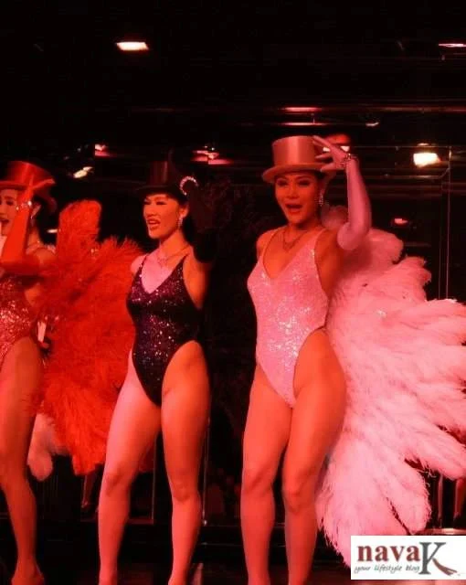 transgender performers in ravishing costumes and make-up, performing in Bangkok Cabaret Show.