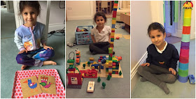 Child sitting in front of her toys