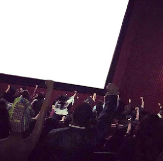 RAISED FISTS AT BLACK PANTHER SCREENING